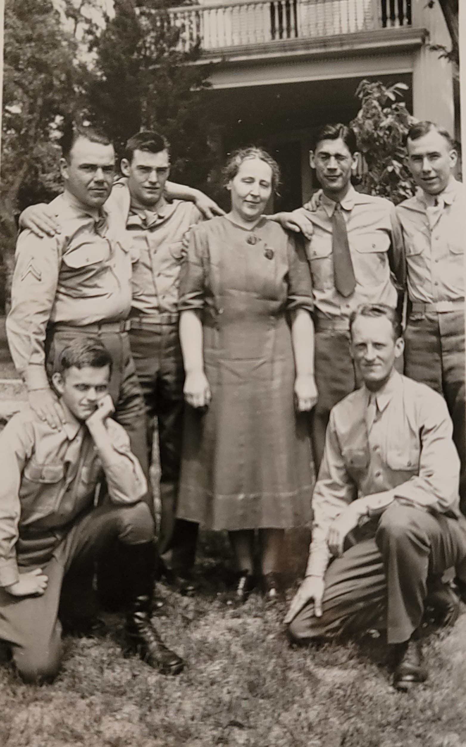 Miss Marion Seelye surrounded by young soldiers