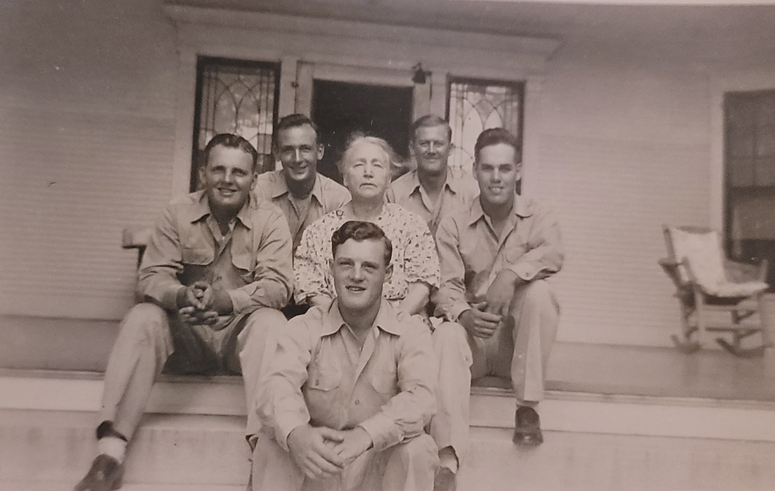 Mrs. Seelye with soldiers on the porch of the Mansion